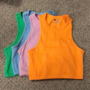 Four high-neck tank tops